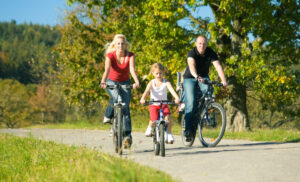 Family on bikes @ istock kzenon 